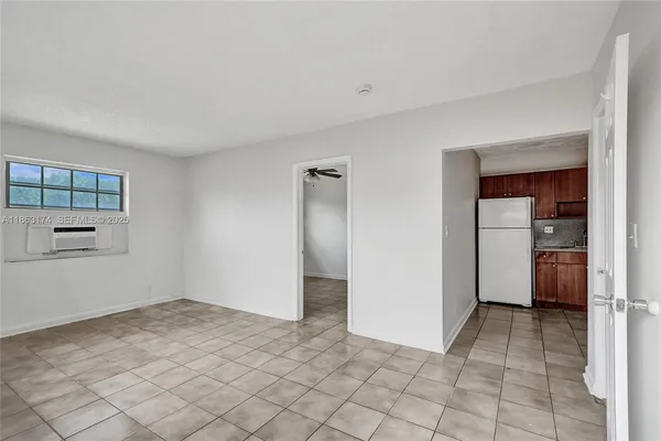 a view of an empty room with windows
