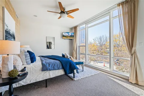 a bed room with a bed and a window