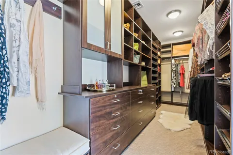 a kitchen with stainless steel appliances granite countertop a refrigerator and a stove