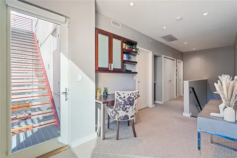 a workspace with furniture and a window