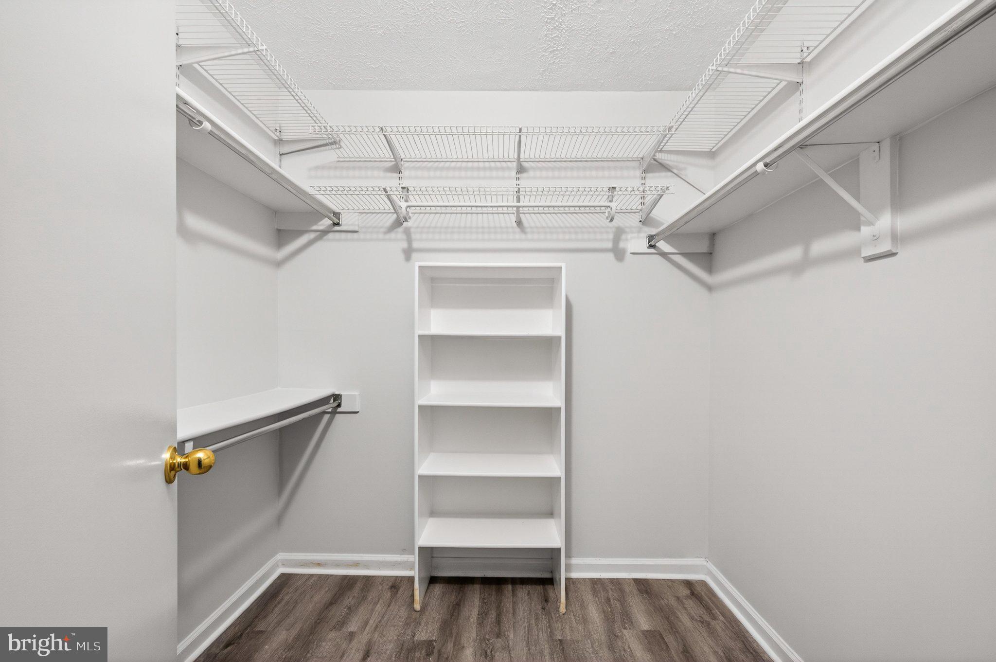 2281 Hunter's Run Drive, Unit 2281 Reston, VA 20191 - Photo 20 of 25 Spacious closet with organized shelving.