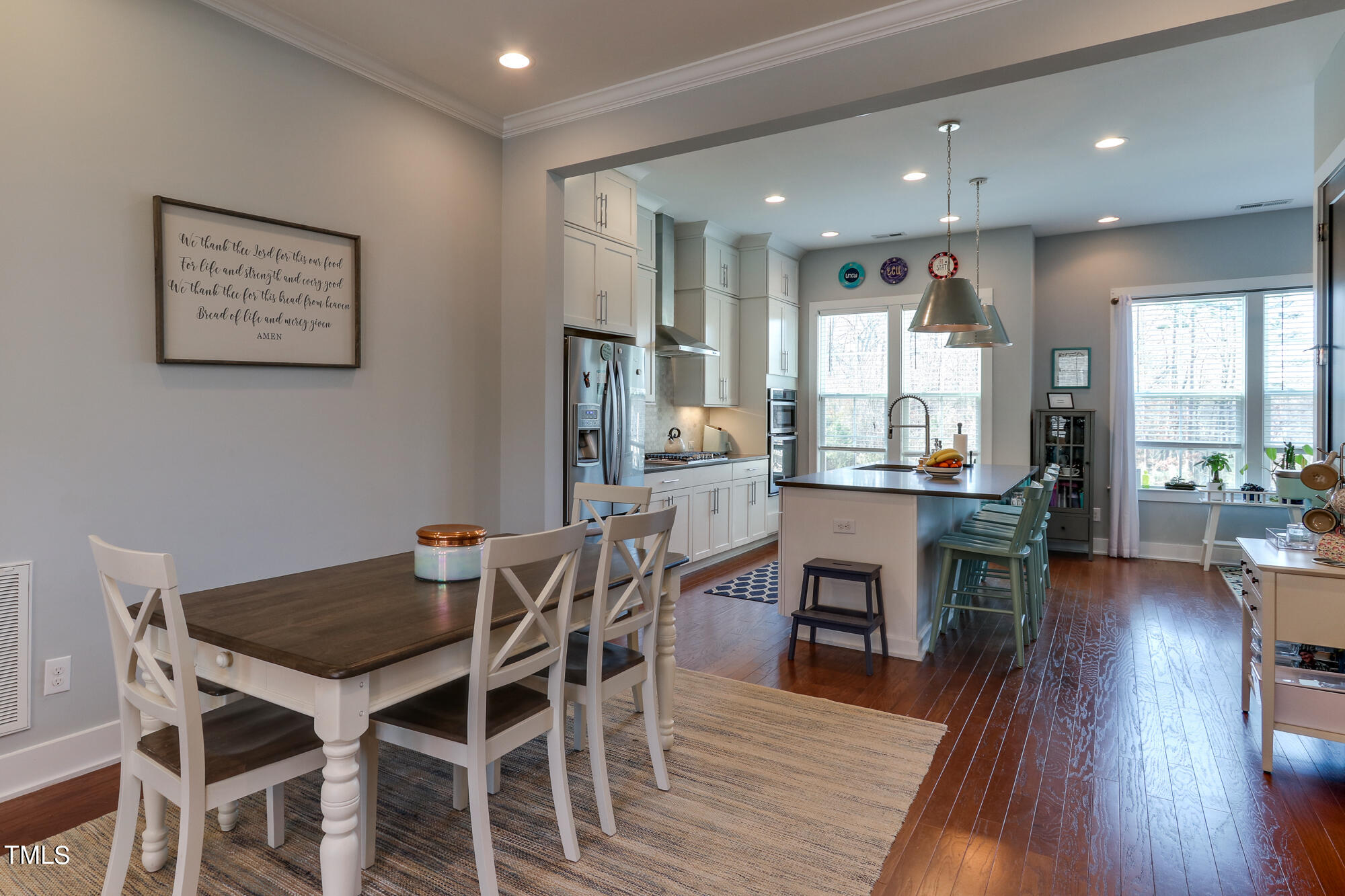 904 Wake Towne Drive Raleigh, NC 27609 - Photo 11 of 30 a view of a dining room with furniture window and wooden floor