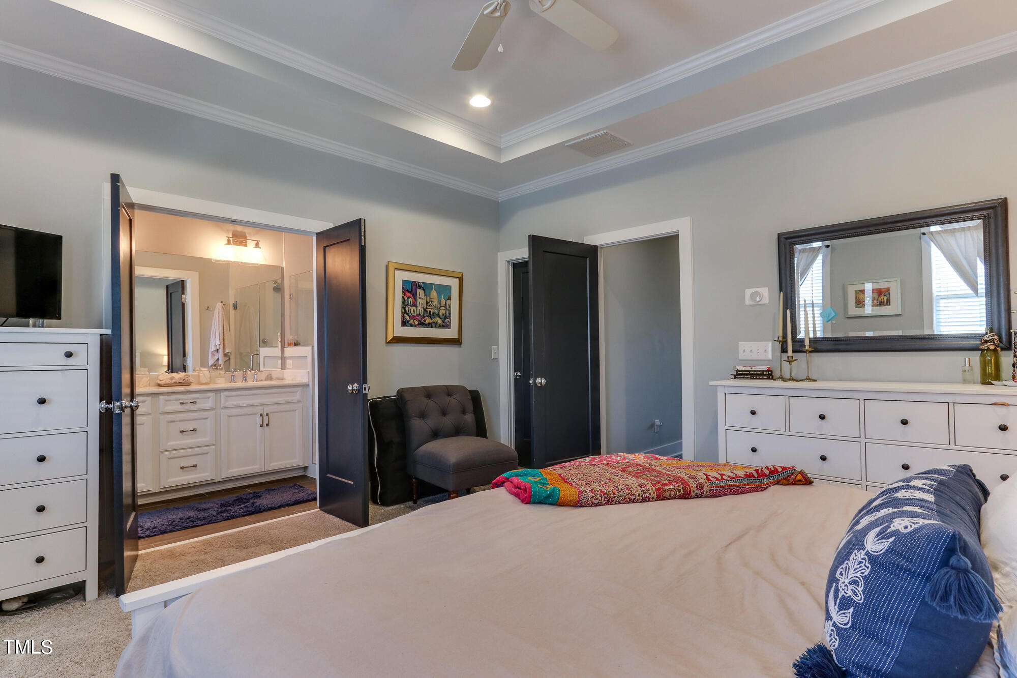 904 Wake Towne Drive Raleigh, NC 27609 - Photo 16 of 30 a bedroom with a bed and a dresser