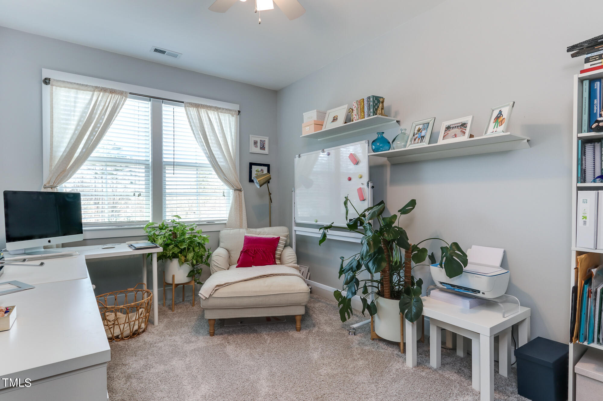 904 Wake Towne Drive Raleigh, NC 27609 - Photo 19 of 30 a living room with furniture and a potted plant