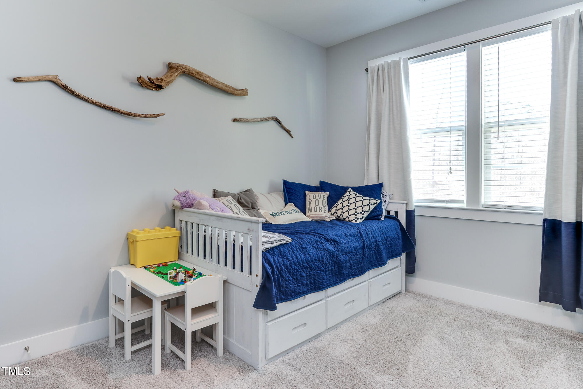 904 Wake Towne Drive Raleigh, NC 27609 - Photo 22 of 30 a bedroom with a bed chair and window