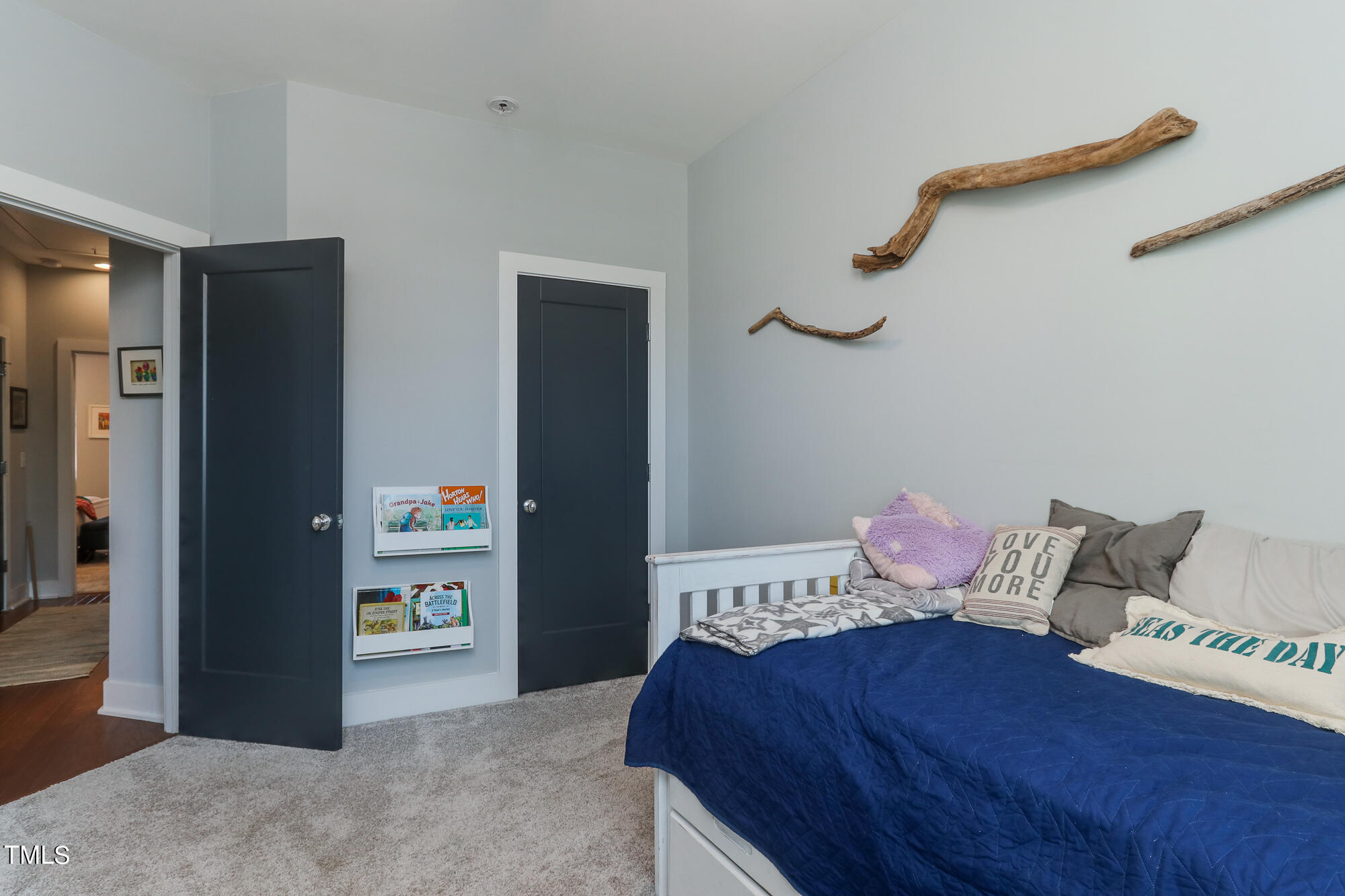 904 Wake Towne Drive Raleigh, NC 27609 - Photo 23 of 30 a bedroom with a bed and wooden floor