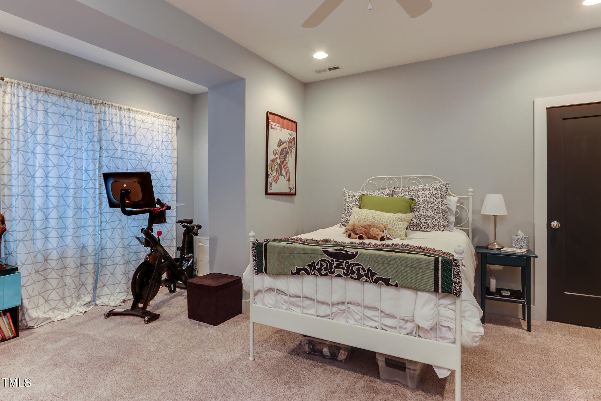 904 Wake Towne Drive Raleigh, NC 27609 - Photo 24 of 30 a bedroom with a bed a couch and a window