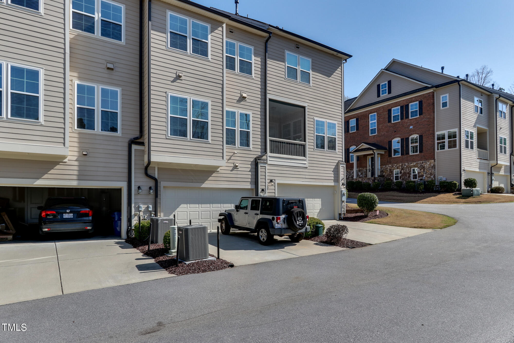 904 Wake Towne Drive Raleigh, NC 27609 - Photo 3 of 30 a view of a street with cars