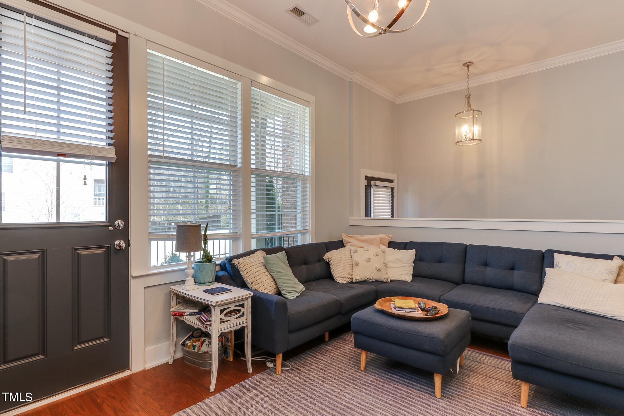 904 Wake Towne Drive Raleigh, NC 27609 - Photo 6 of 30 a living room with furniture and a window