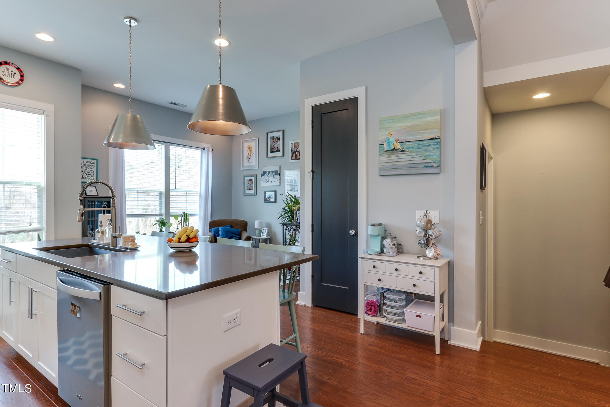 904 Wake Towne Drive Raleigh, NC 27609 - Photo 10 of 30 a kitchen with sink cabinets and wooden floor