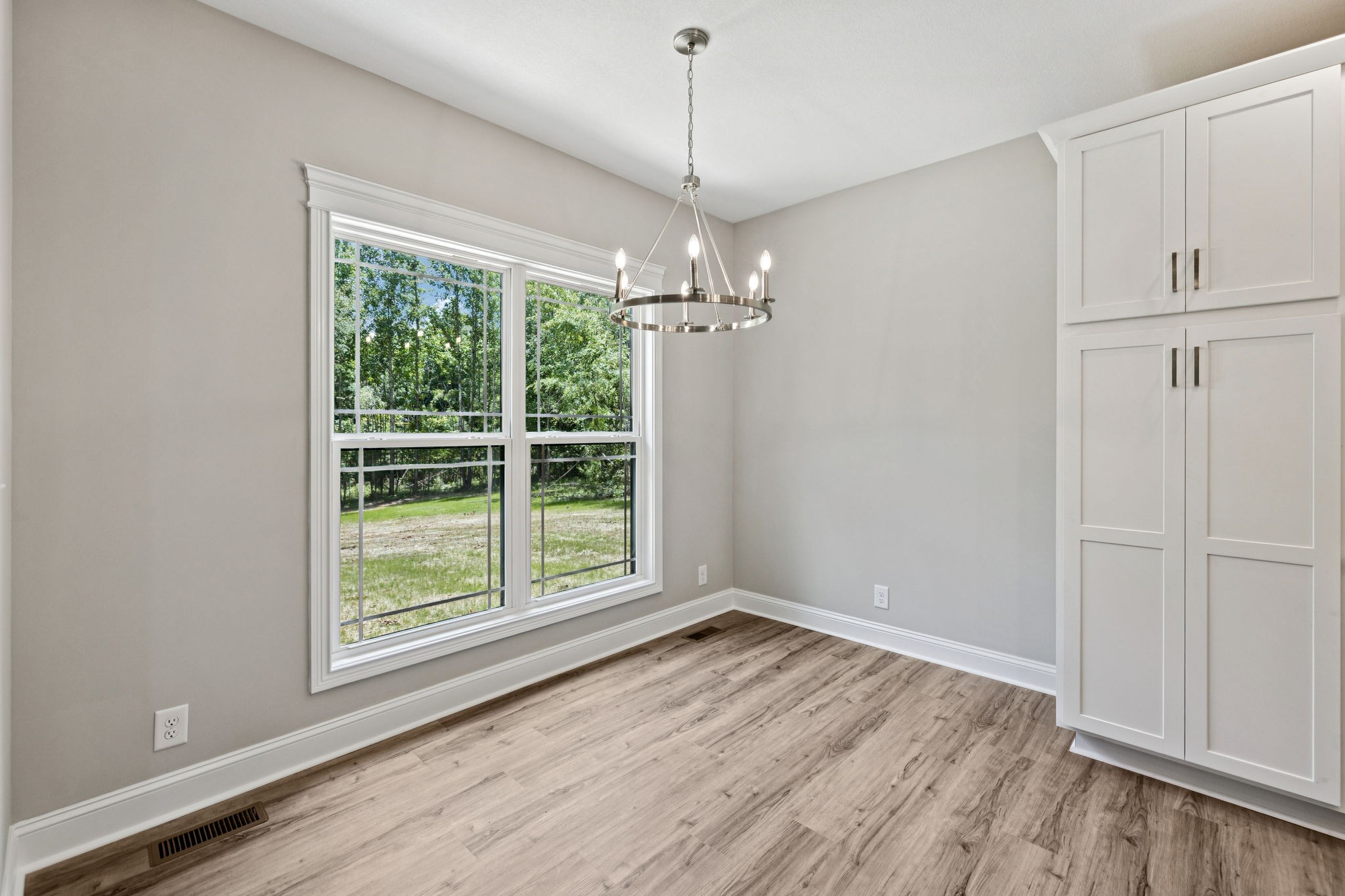 1017 Gholson Road Clarksville, TN 37043 - Photo 17 of 58 a view of a room with wooden floor and windows