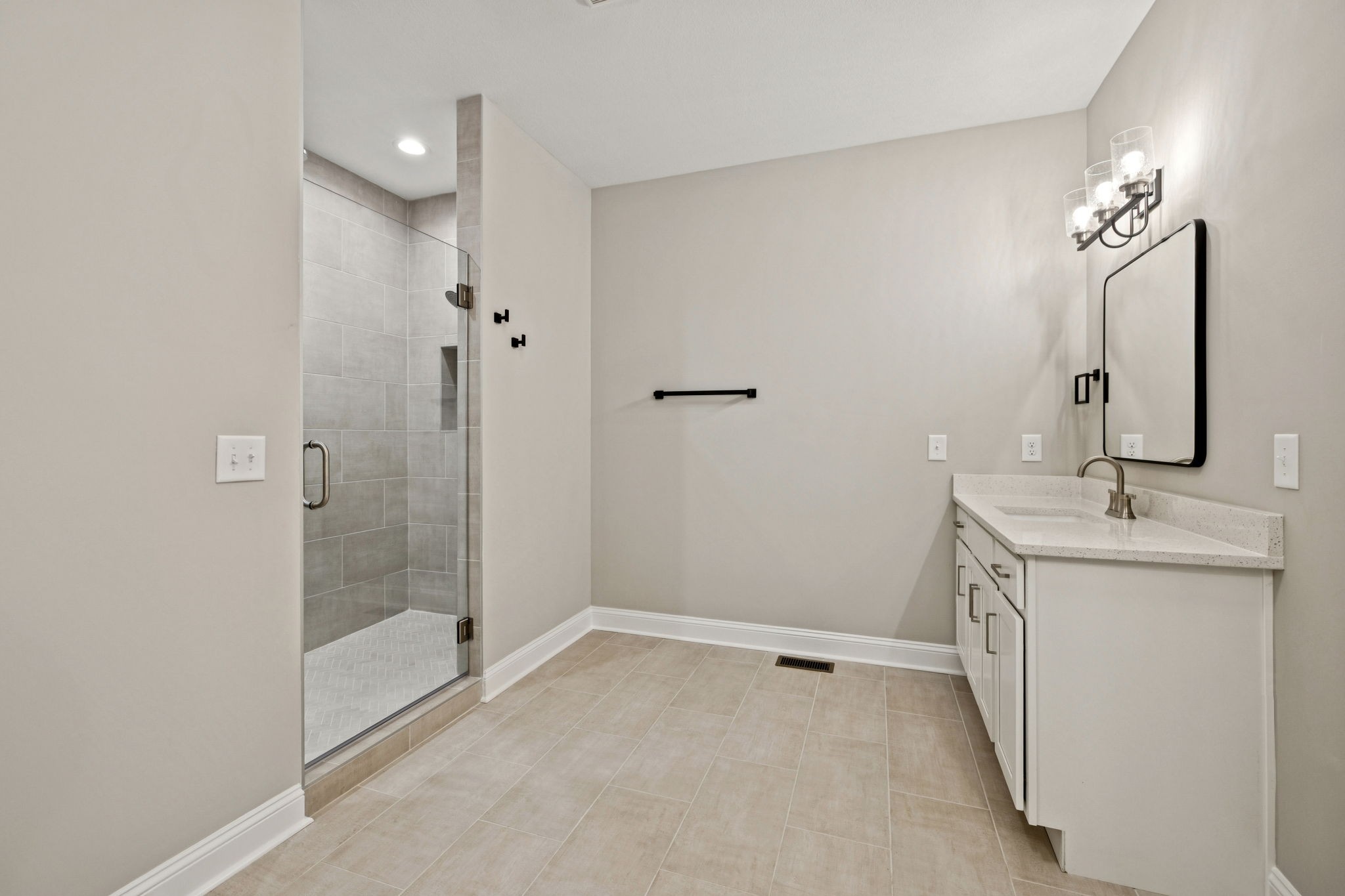 1017 Gholson Road Clarksville, TN 37043 - Photo 23 of 58 a bathroom with a double vanity sink mirror and shower