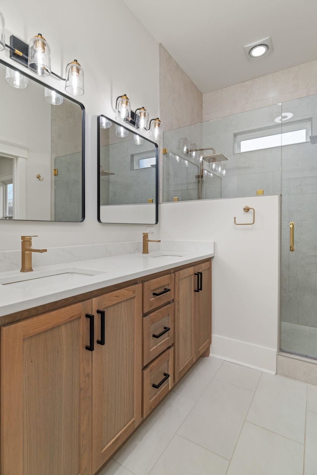 69 County Road 157 Corinth, MS 38834 - Photo 19 of 39 a spacious bathroom with a double vanity sink a mirror and shower