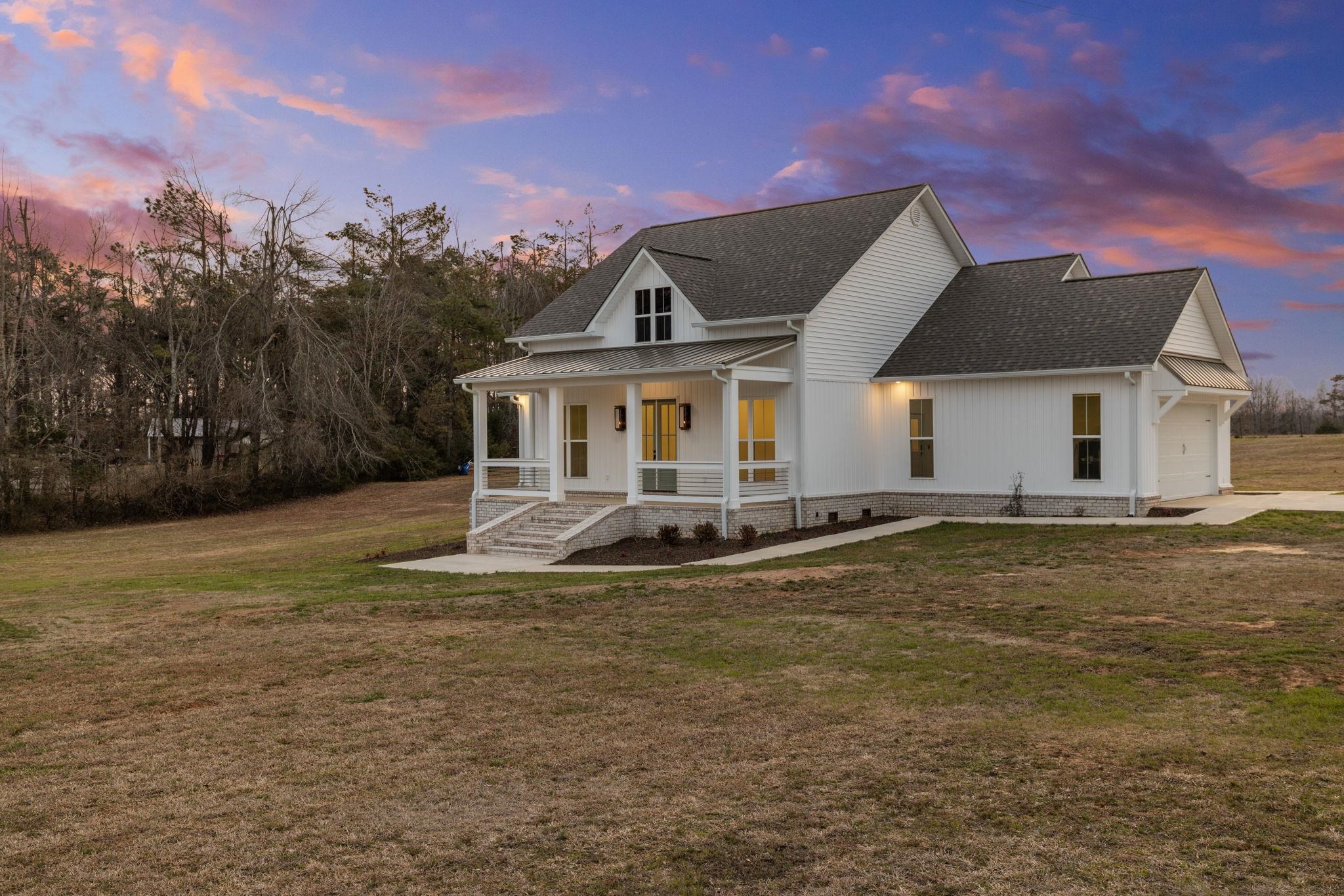 69 County Road 157 Corinth, MS 38834 - Photo 2 of 39 a front view of a house with a yard