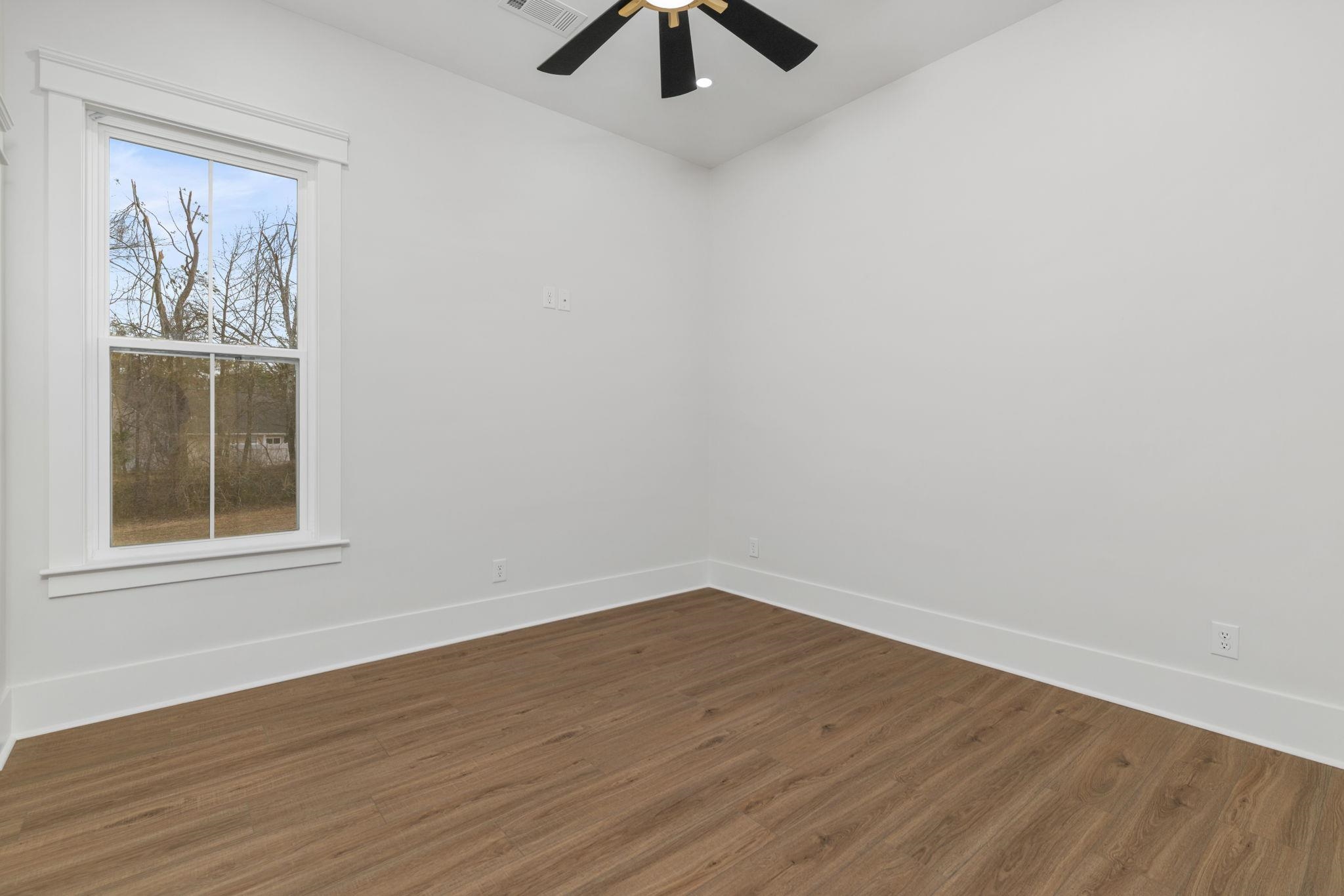 69 County Road 157 Corinth, MS 38834 - Photo 24 of 39 an empty room with a window and a ceiling fan