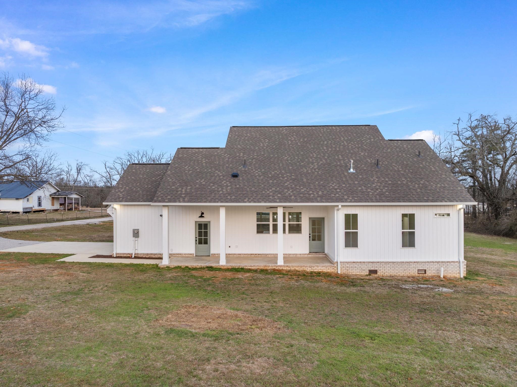 69 County Road 157 Corinth, MS 38834 - Photo 30 of 39 Rear view of house featuring roof with shingles, crawl space, and a lawn