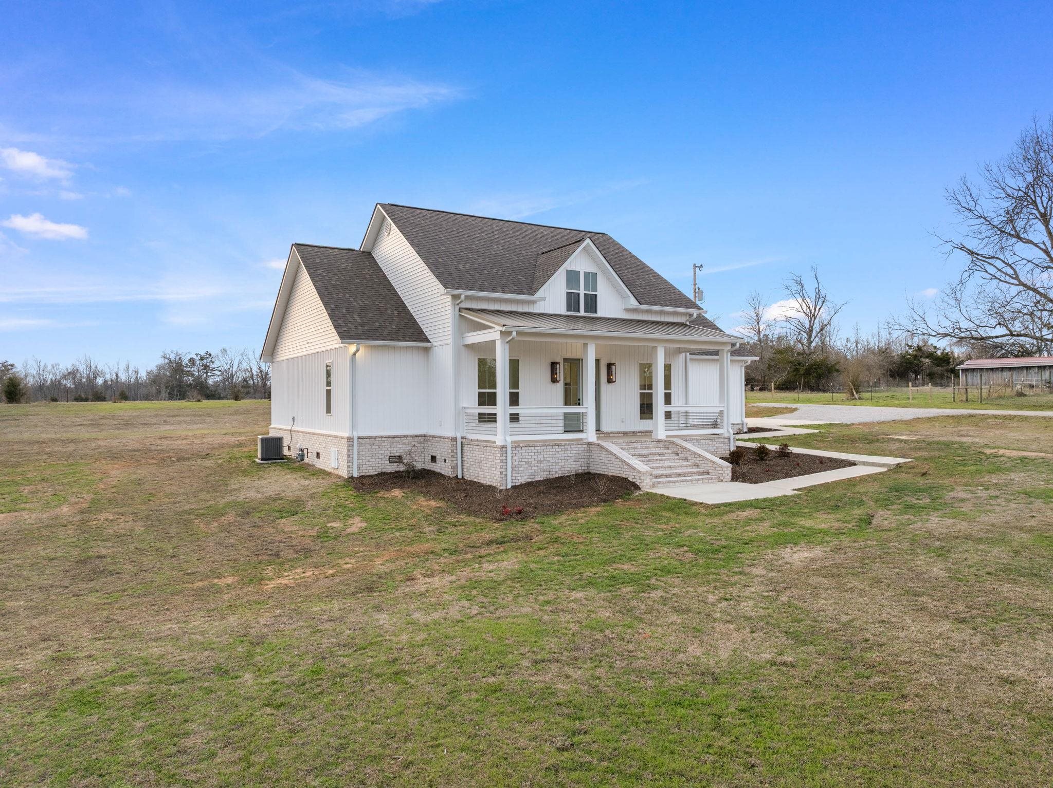 69 County Road 157 Corinth, MS 38834 - Photo 4 of 39 a view of a house with a swimming pool
