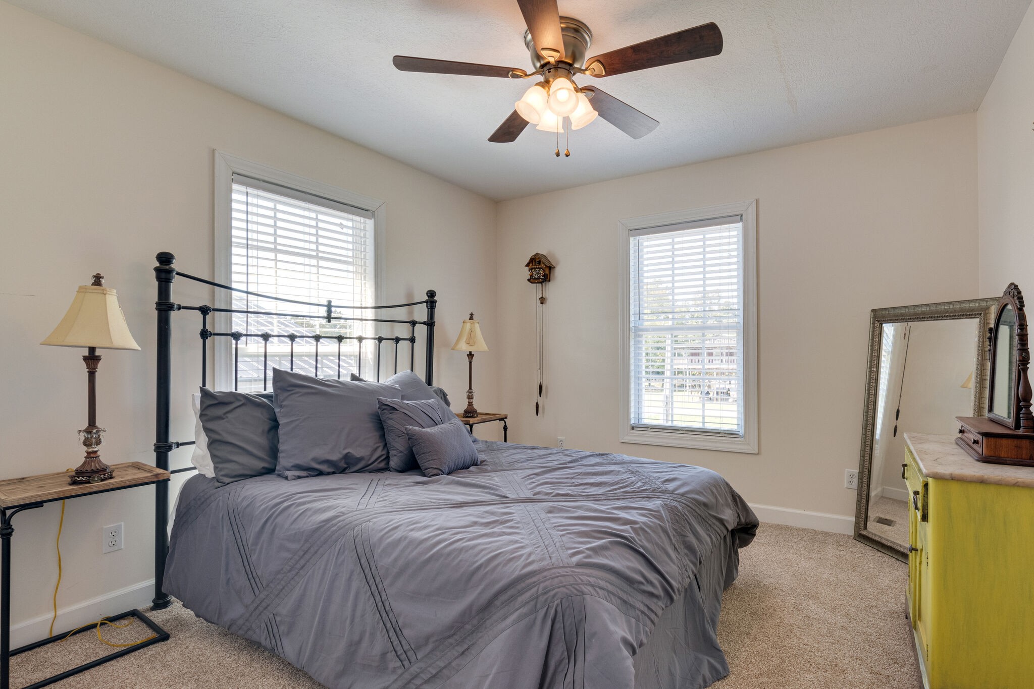 752 Pevahouse Camp Lane Decaturville, TN 38329 - Photo 19 of 47 a bedroom with a large bed and a chandelier