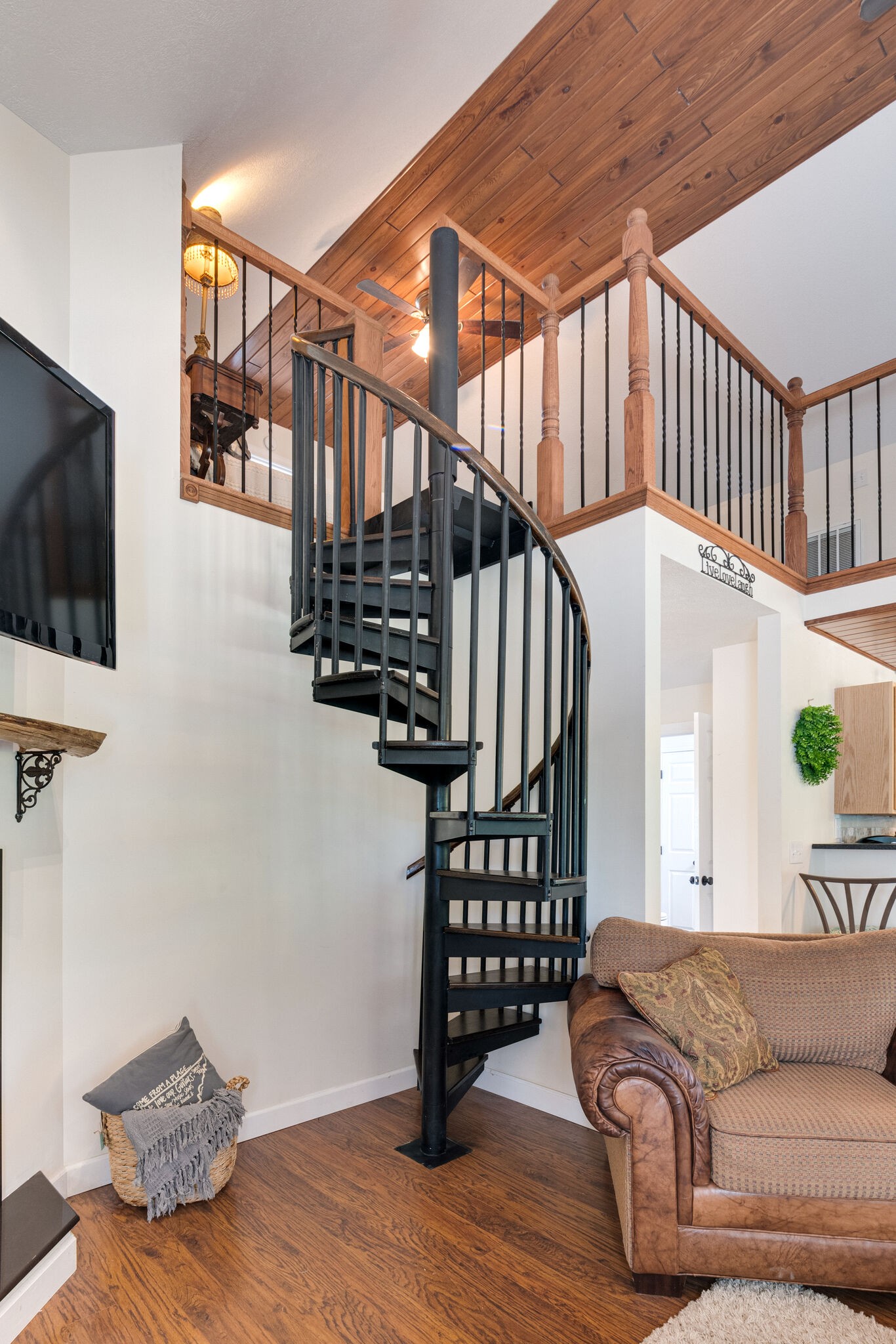 752 Pevahouse Camp Lane Decaturville, TN 38329 - Photo 21 of 47 a living room with wooden floor and stairs