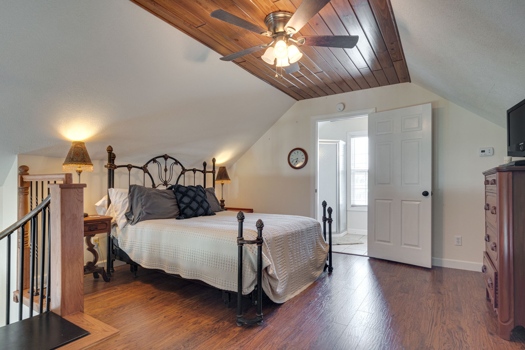 752 Pevahouse Camp Lane Decaturville, TN 38329 - Photo 23 of 47 a bedroom with a bed and a chandelier