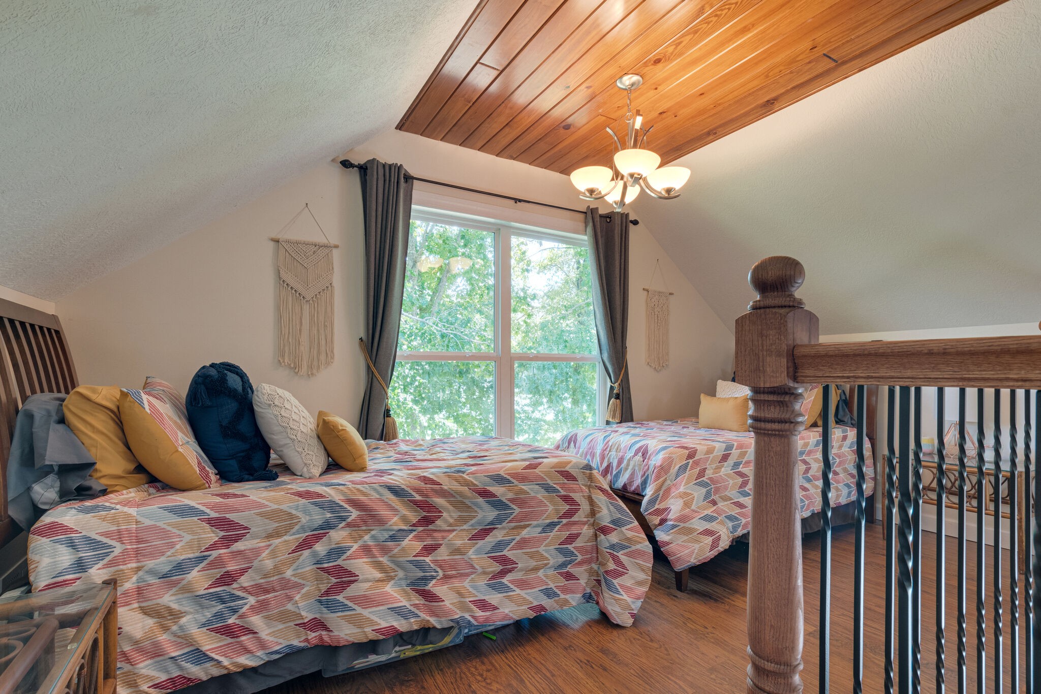 752 Pevahouse Camp Lane Decaturville, TN 38329 - Photo 26 of 47 a bedroom with a bed and a chandelier