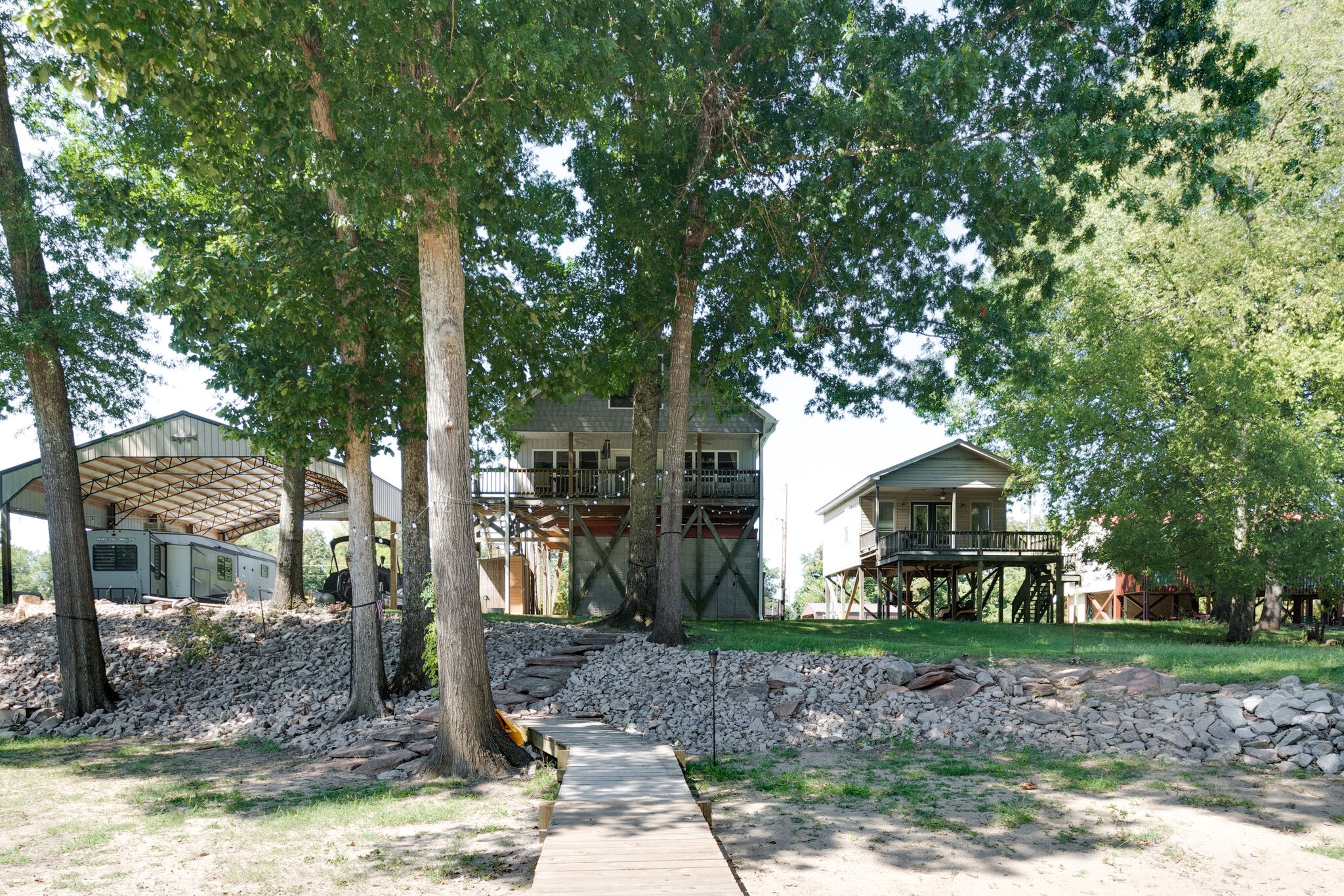 752 Pevahouse Camp Lane Decaturville, TN 38329 - Photo 28 of 47 a view of a house with a yard and tree s