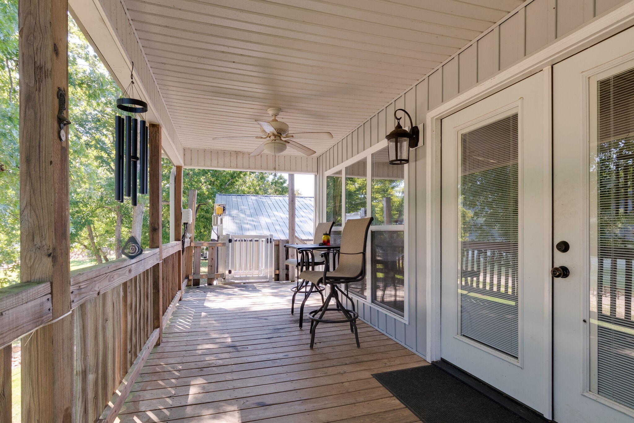 752 Pevahouse Camp Lane Decaturville, TN 38329 - Photo 29 of 47 a view of a porch with wooden floor and outdoor space