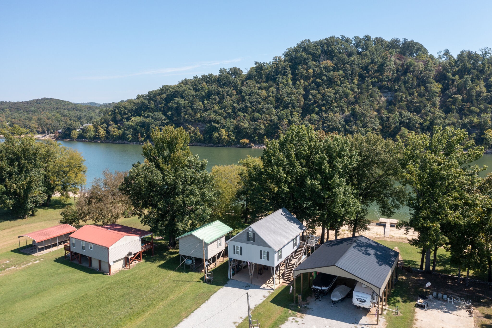 752 Pevahouse Camp Lane Decaturville, TN 38329 - Photo 37 of 47 a front view of a house with garden space and lake view