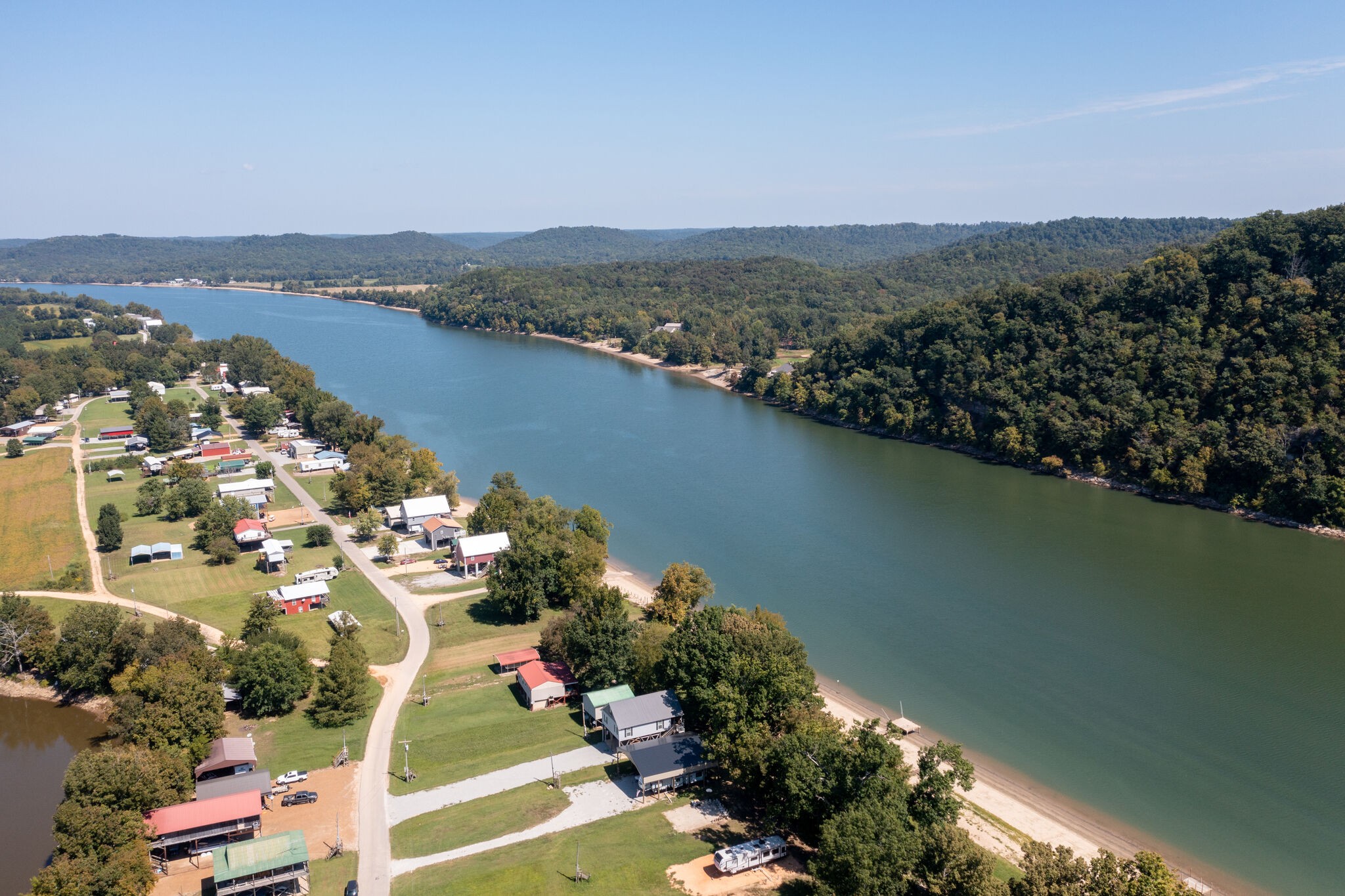 752 Pevahouse Camp Lane Decaturville, TN 38329 - Photo 39 of 47 an aerial view of lake and residential houses with outdoor space