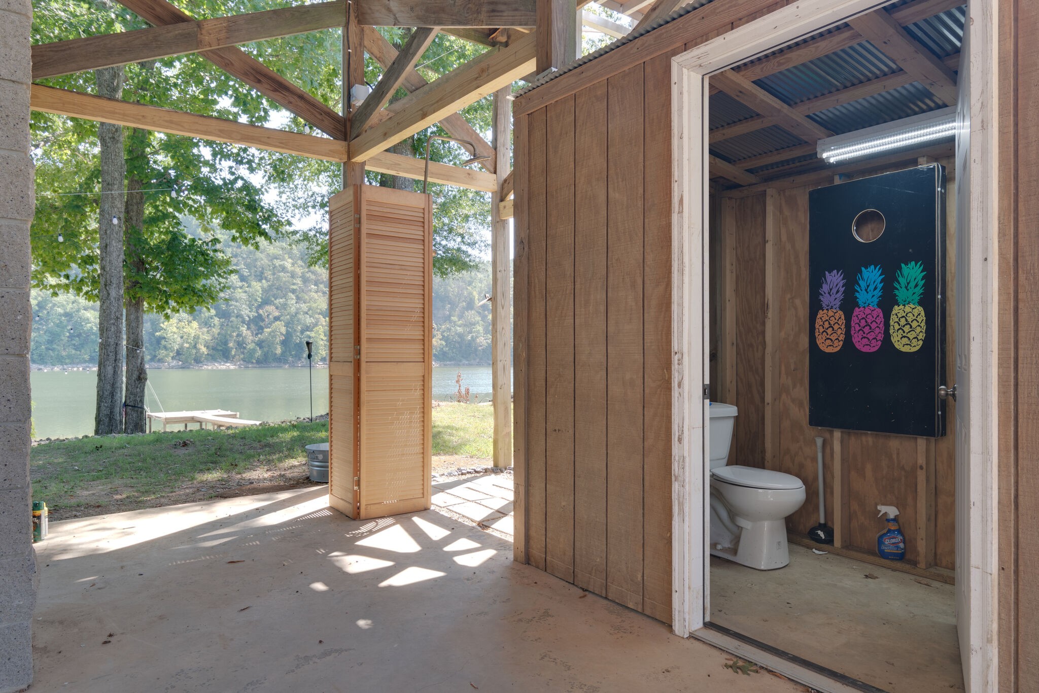 752 Pevahouse Camp Lane Decaturville, TN 38329 - Photo 6 of 47 a view of a bathroom with a toilet and a shower