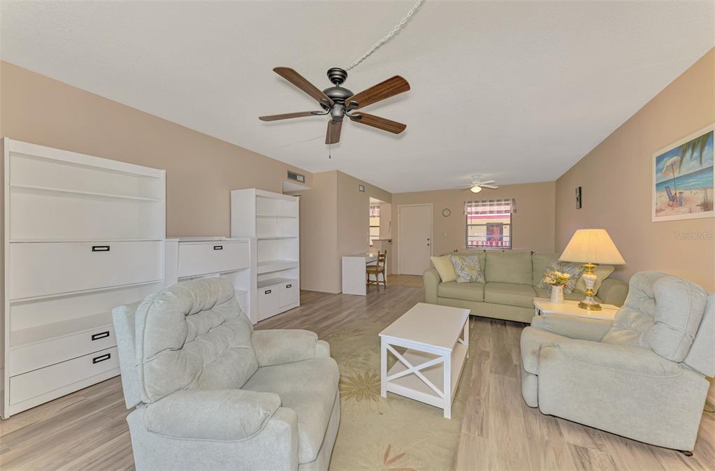 96 Boundary Boulevard, Unit 127 Rotonda West, FL 33947 - Photo 13 of 47 a living room with furniture white walls and a window