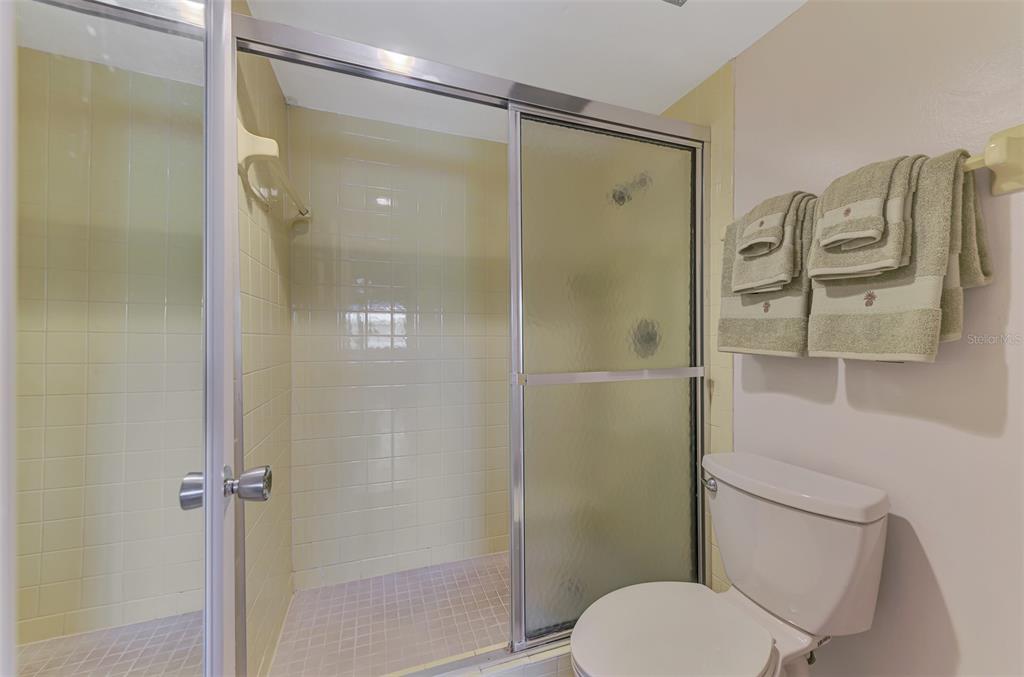 96 Boundary Boulevard, Unit 127 Rotonda West, FL 33947 - Photo 20 of 47 a bathroom with a shower and toilet