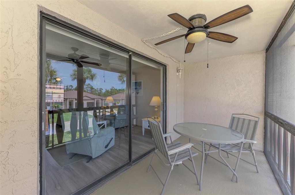96 Boundary Boulevard, Unit 127 Rotonda West, FL 33947 - Photo 24 of 47 a view of a hallway with a dining room and furniture