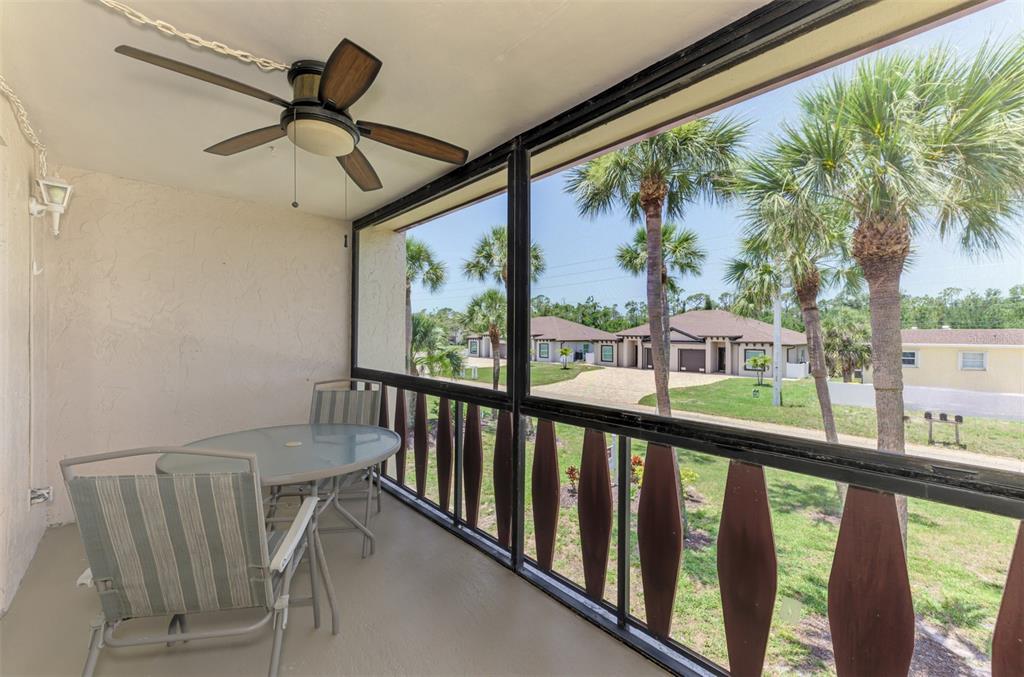 96 Boundary Boulevard, Unit 127 Rotonda West, FL 33947 - Photo 26 of 47 a view of a porch with furniture and a window