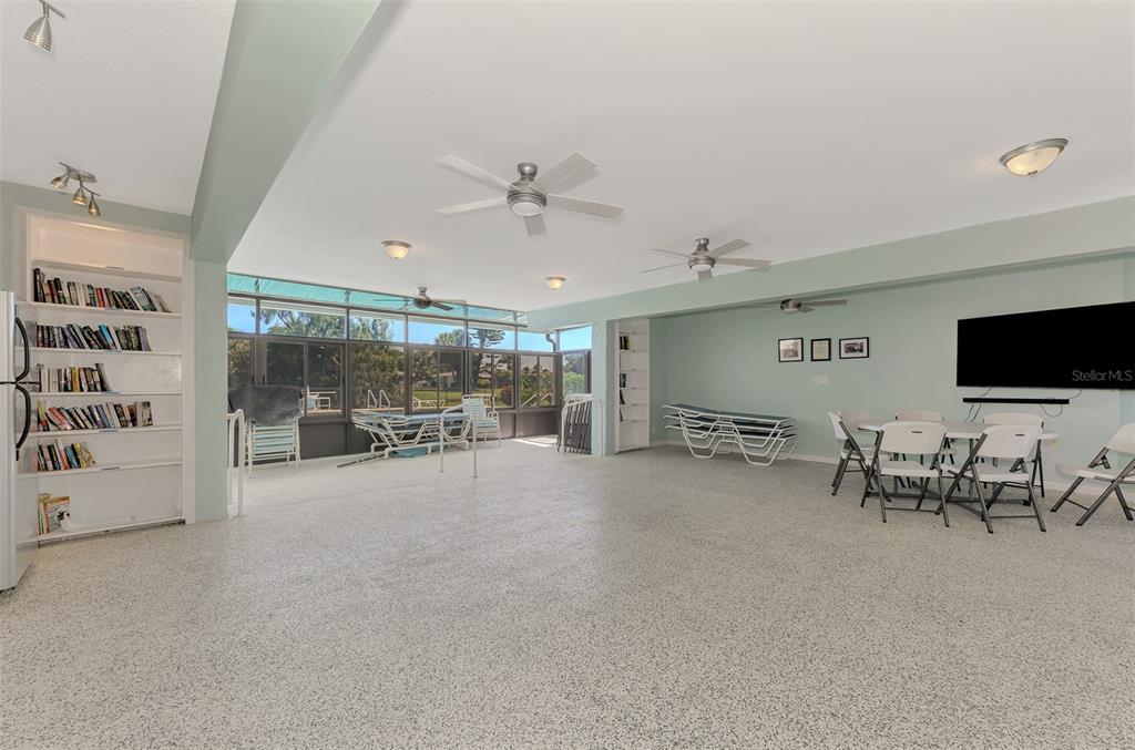 96 Boundary Boulevard, Unit 127 Rotonda West, FL 33947 - Photo 31 of 47 a view of a livingroom with furniture and a garage