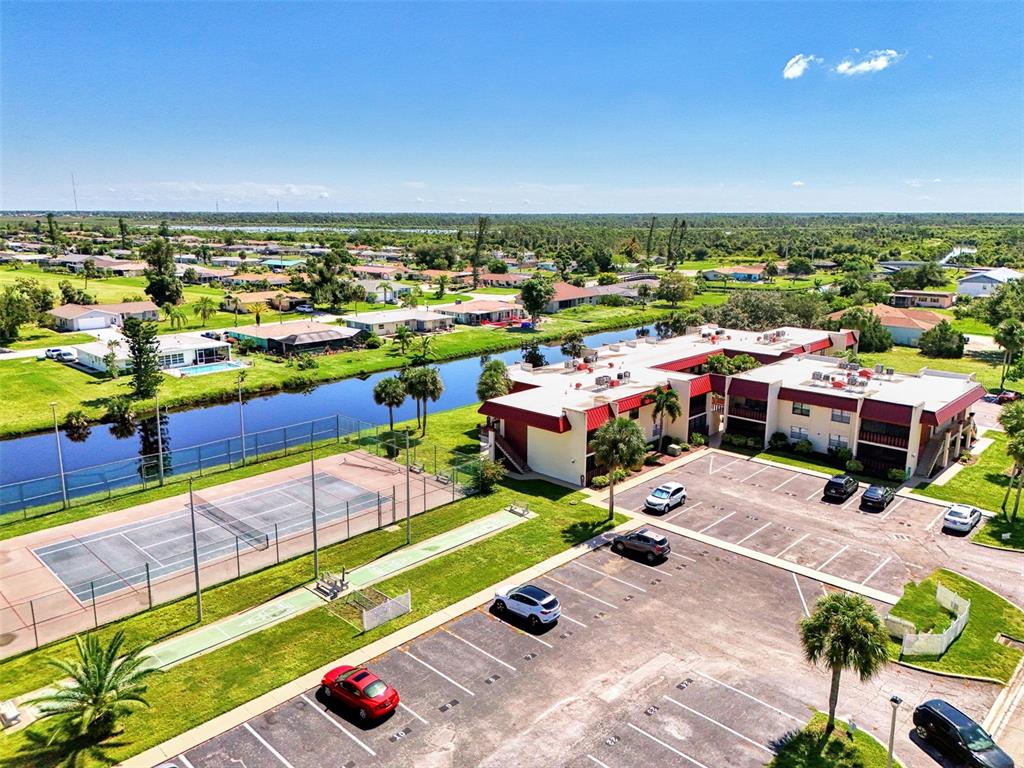 96 Boundary Boulevard, Unit 127 Rotonda West, FL 33947 - Photo 34 of 47 an aerial view of a city