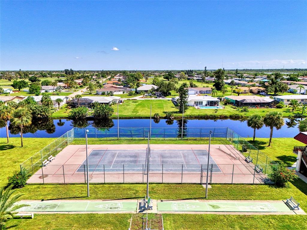 96 Boundary Boulevard, Unit 127 Rotonda West, FL 33947 - Photo 35 of 47 a view of a tennis court