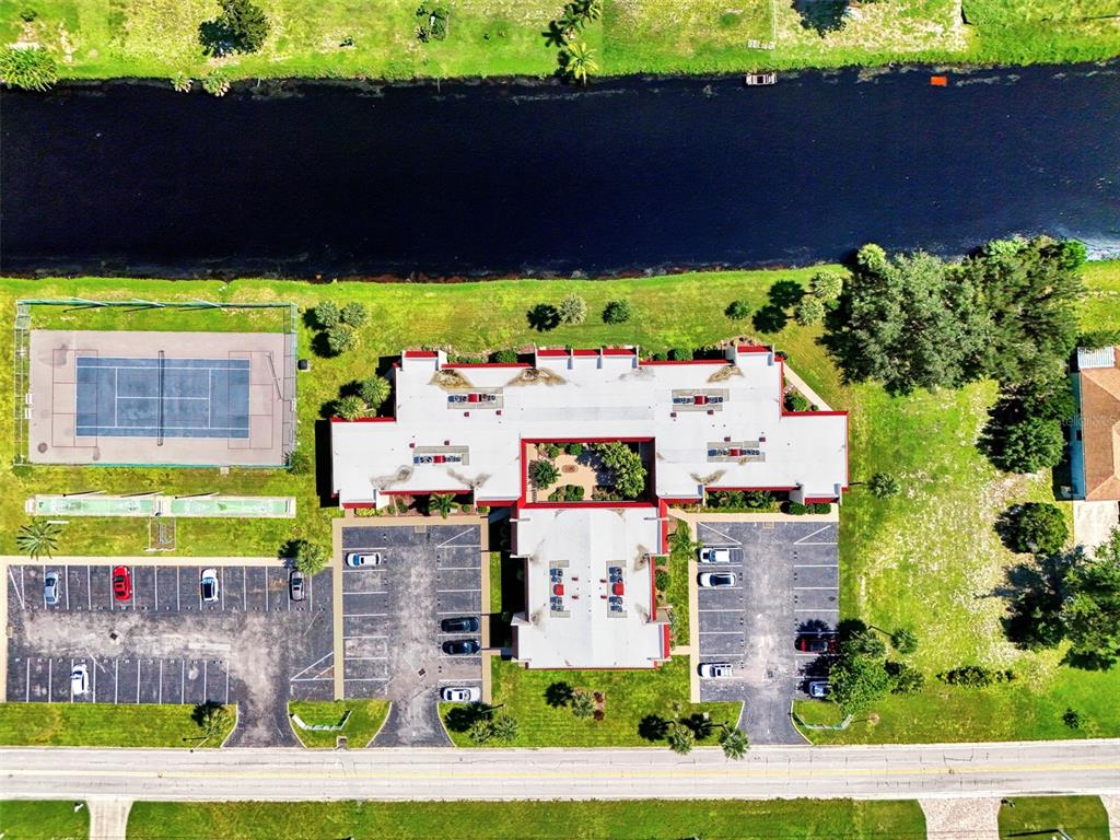96 Boundary Boulevard, Unit 127 Rotonda West, FL 33947 - Photo 36 of 47 an aerial view of a house with a yard