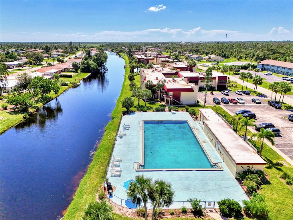 96 Boundary Boulevard, Unit 127 Rotonda West, FL 33947 - Photo 44 of 47 an aerial view of a house with a swimming pool