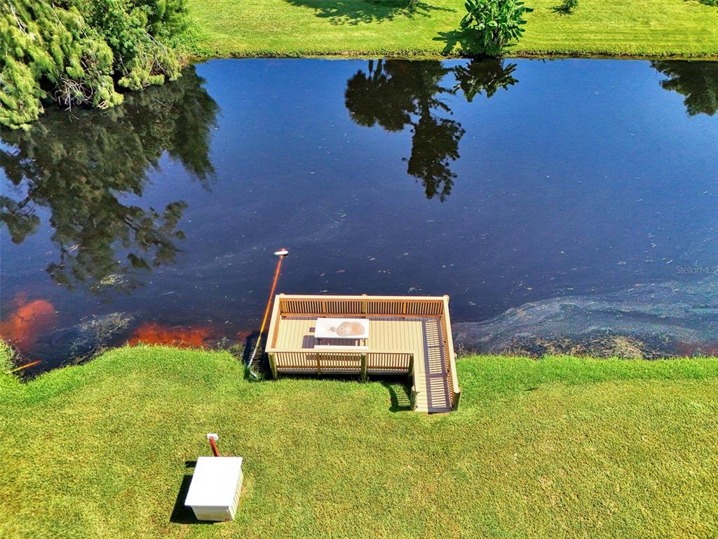 96 Boundary Boulevard, Unit 127 Rotonda West, FL 33947 - Photo 47 of 47 a backyard of a house with lots of green space