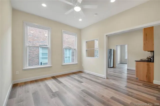 a view of livingroom with hardwood floor and a ceiling fan