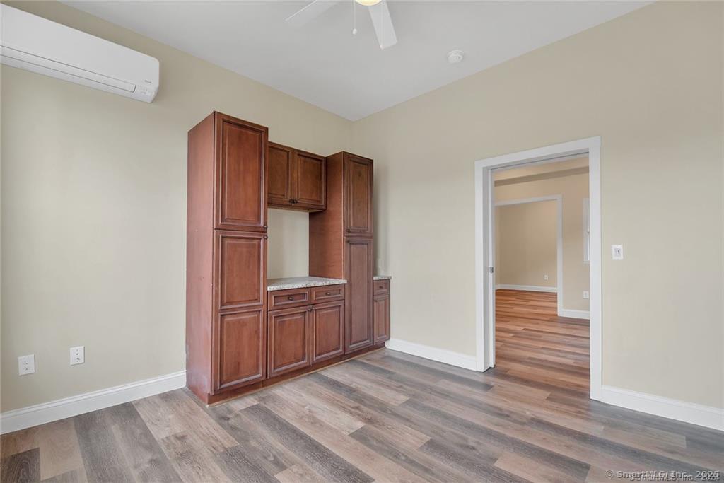 120 East Main Street, Unit 6 Torrington, CT 06790 - Photo 10 of 12 wooden floor and cabinet in a room