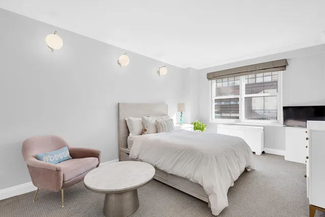 a living room with furniture and a window