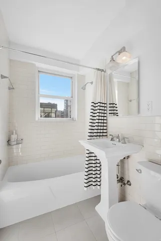 a bedroom with a bed and a chair