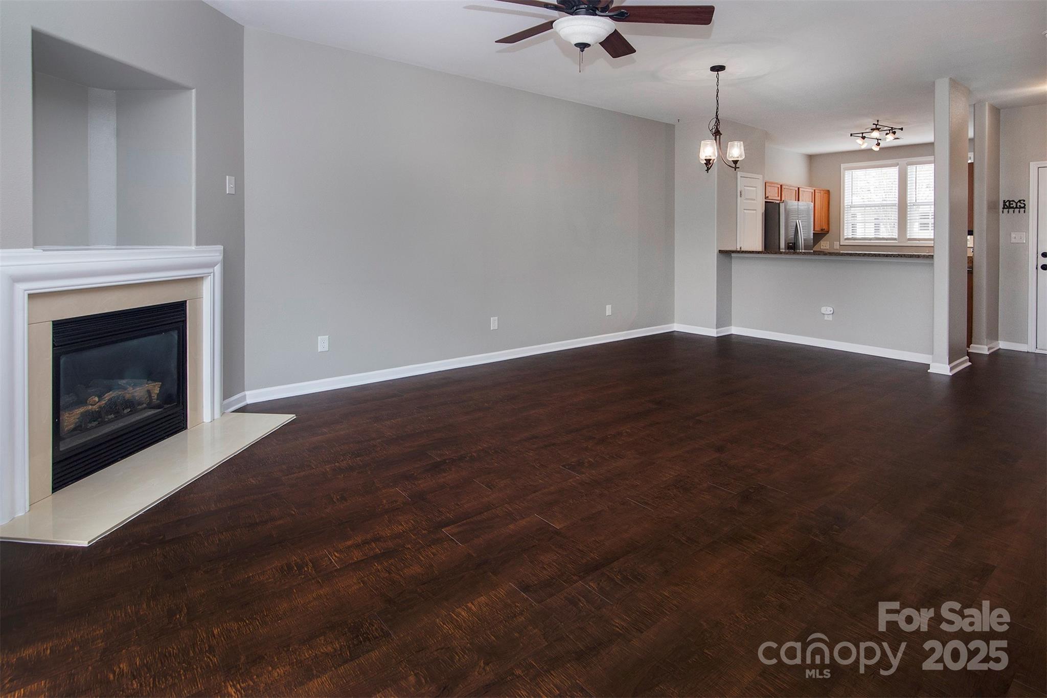 6310 Rhodins Lane Fort Mill, SC 29707 - Photo 13 of 22 a view of a kitchen with a sink and a fireplace