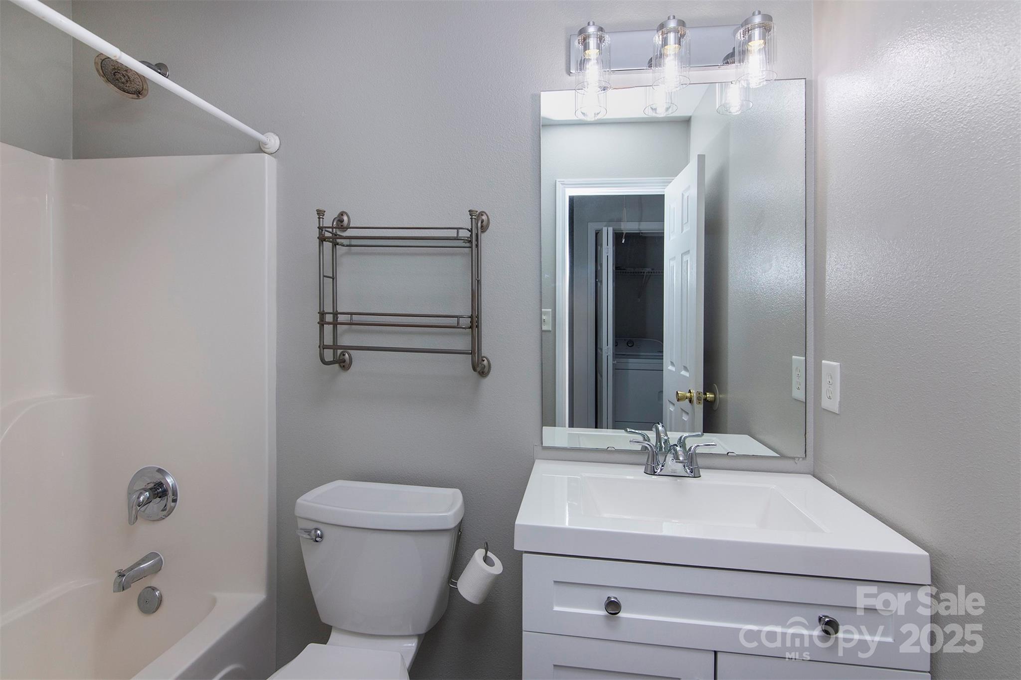 6310 Rhodins Lane Fort Mill, SC 29707 - Photo 19 of 22 a bathroom with a sink a toilet and shower