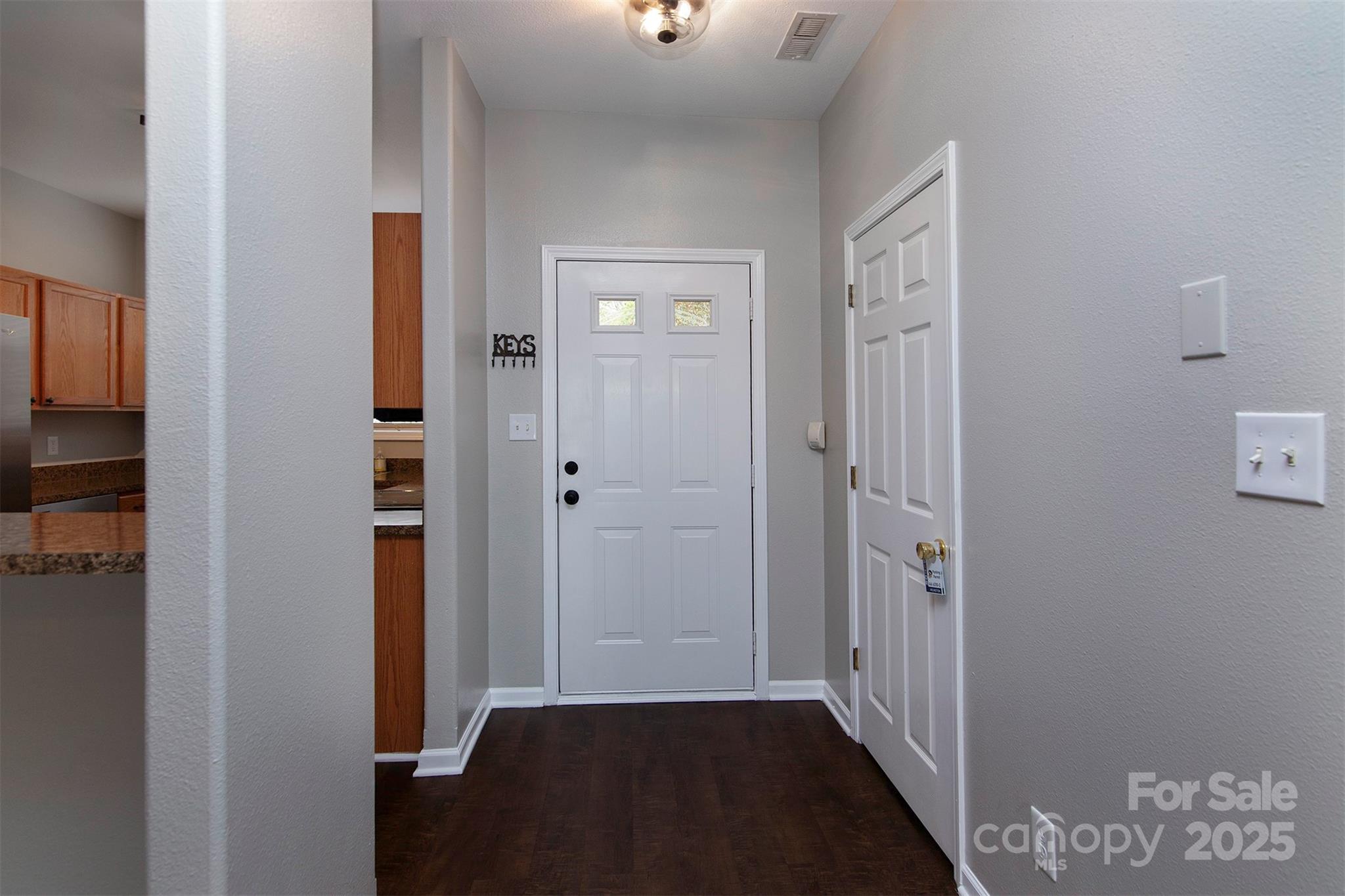 6310 Rhodins Lane Fort Mill, SC 29707 - Photo 9 of 22 a view of a hallway with wooden floor and closet area