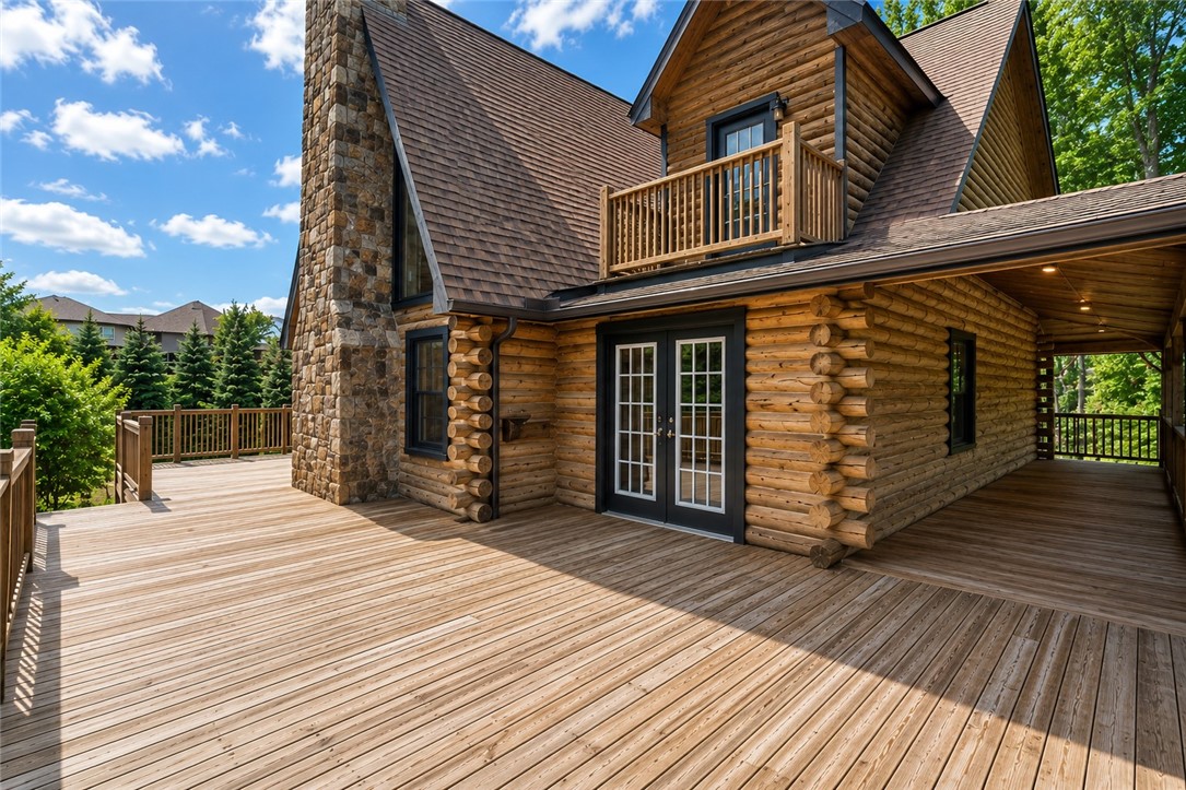 414 Devon Way Anderson, SC 29621 - Photo 39 of 50 An expansive outdoor deck offers abundant space for relaxation and entertaining, complementing the rustic charm of this log cabin's exterior.