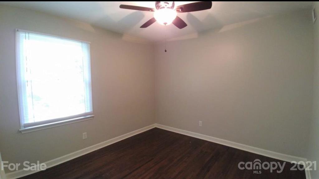 6517 Park Road Charlotte, NC 28210 - Photo 16 of 20 an empty room with a window