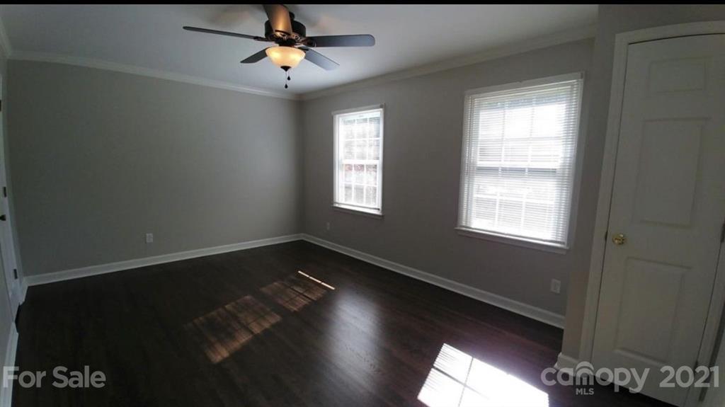 6517 Park Road Charlotte, NC 28210 - Photo 18 of 20 a view of empty room with wooden floor and fan